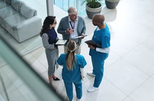 Doctors and medical professionals discussing patient care and HRAs