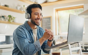 Excited employee learning new skills through online job training