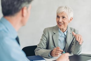 Manager discussing performance plans with employee
