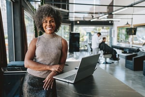Young employee in modern office workplace