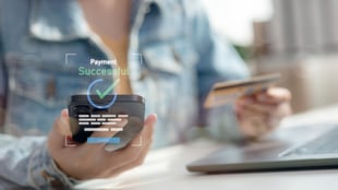 Customer using gift card to pay at digital check-out