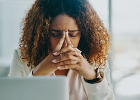 Unhappy employee feeling disengaged and frustrated at work