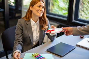Employee receiving end-of-year holiday bonus or gift card incentive