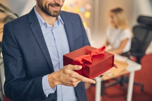 Employee receiving gift card reward for end of year recognition