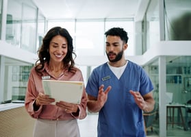 Corporate health program administrator discussing employee incentive strategies