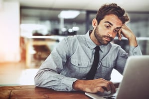 Bored sales employee at his desk