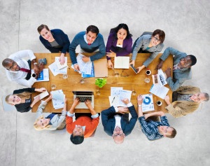 Multi-Ethnic Group of People in a Meeting Looking Up