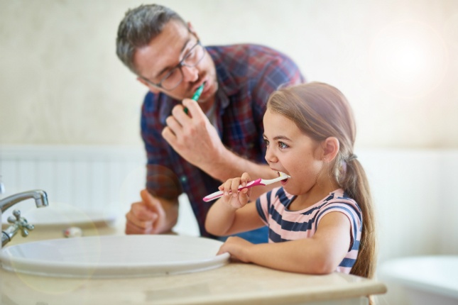 Toothbrush-Daughter-Father-Health-Wellness.jpg