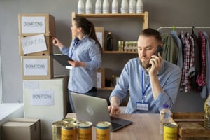 Nonprofit volunteer working to coordinate aid and gift card distribution