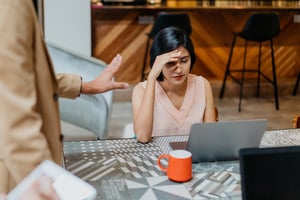 Manager giving negative feedback to a frustrated employee