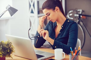 Stressed employee at her desk