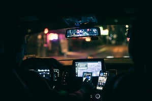 Employee traveling safely in Uber rideshare during the holidays