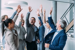 Happy team celebrating business success