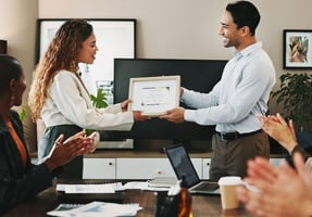 Employee receiving micro-reward for employee recognition