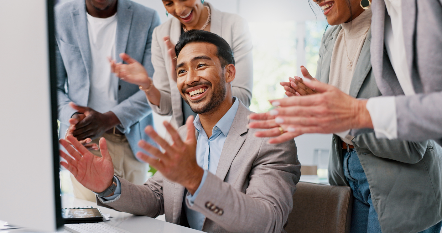 Employee being applauded for employee appreciation day