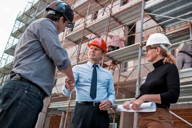 Foreman shaking employee's hand