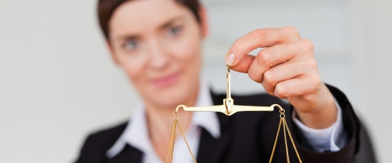 Professional woman holding balancing scale